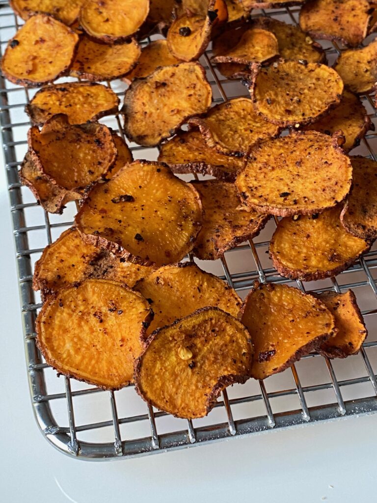 cooking rack full of BBQ sweet potato chips 