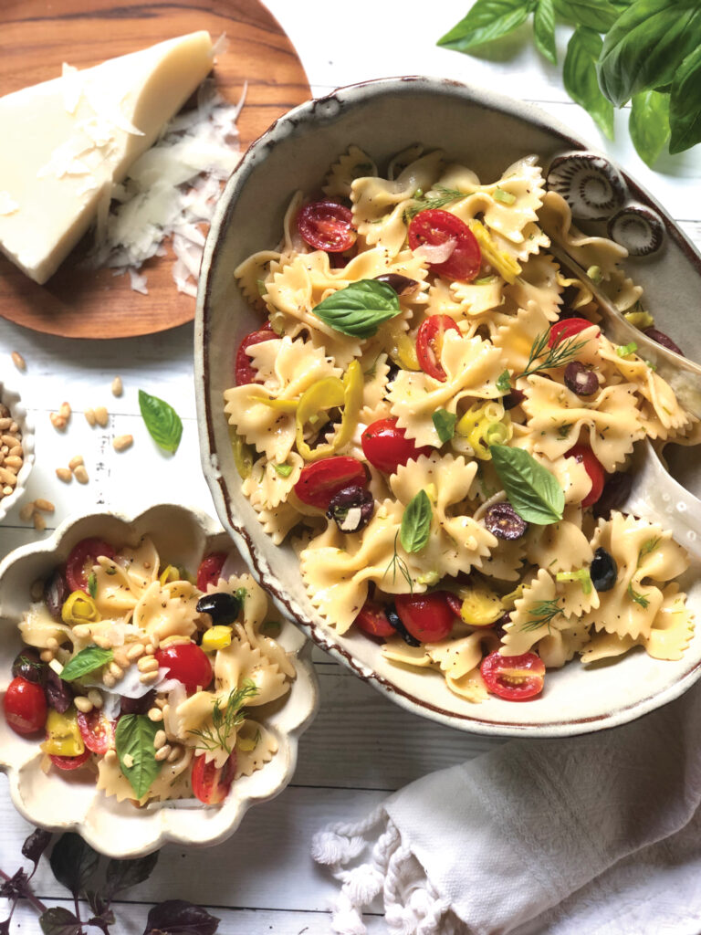 bowtie pasta tossed with mediterranean ingredients like tomatoes, olives, onions and more