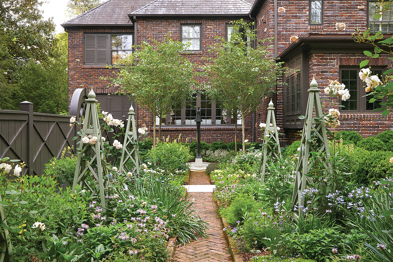 Blooming garden outside a brick home