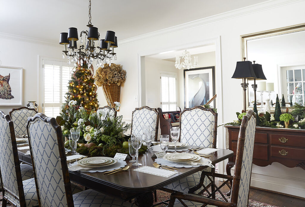 A wider shot of the traditional dining room with Christmas tree