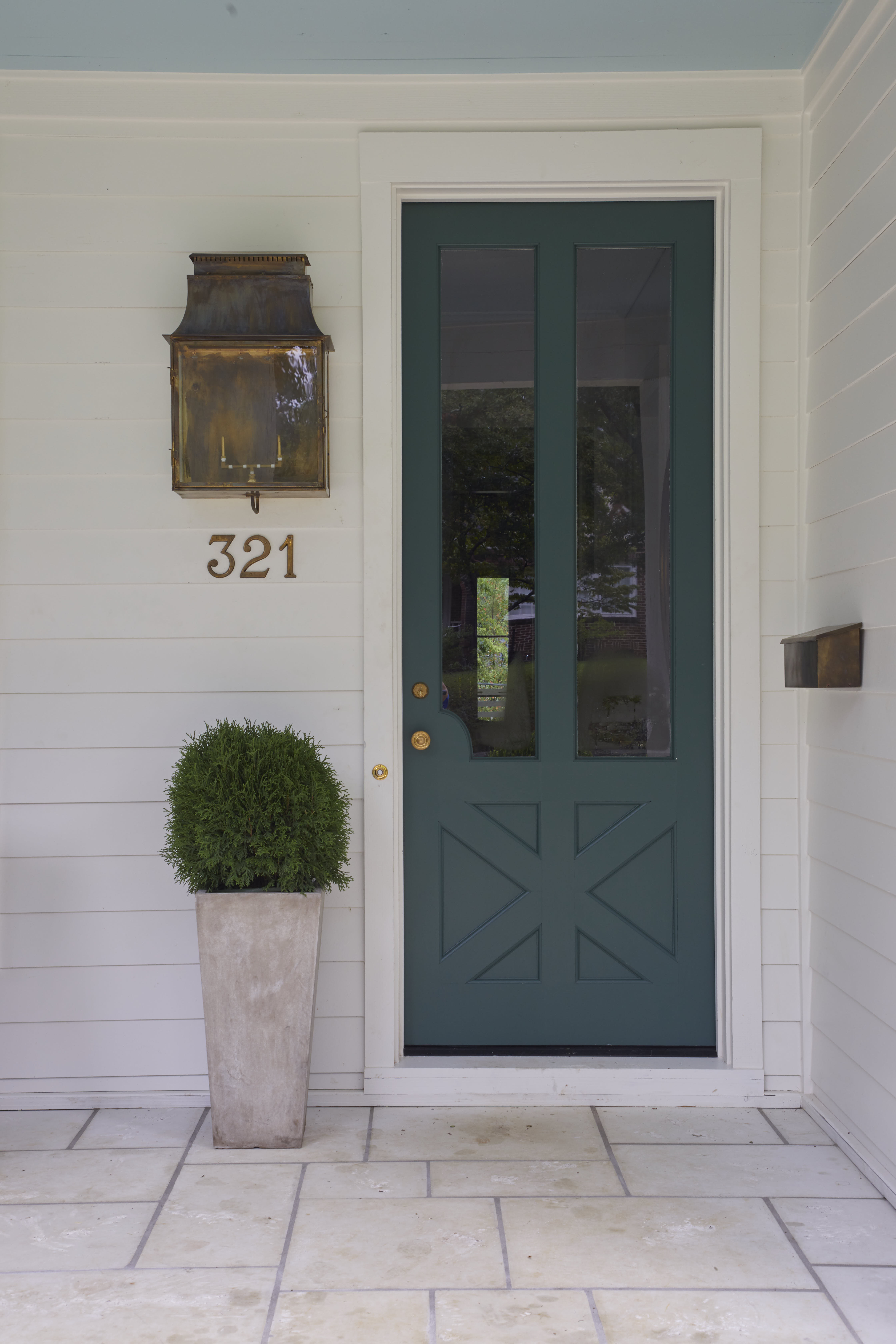 Front door painted in Benjamin Moore color "Lafayette Green"