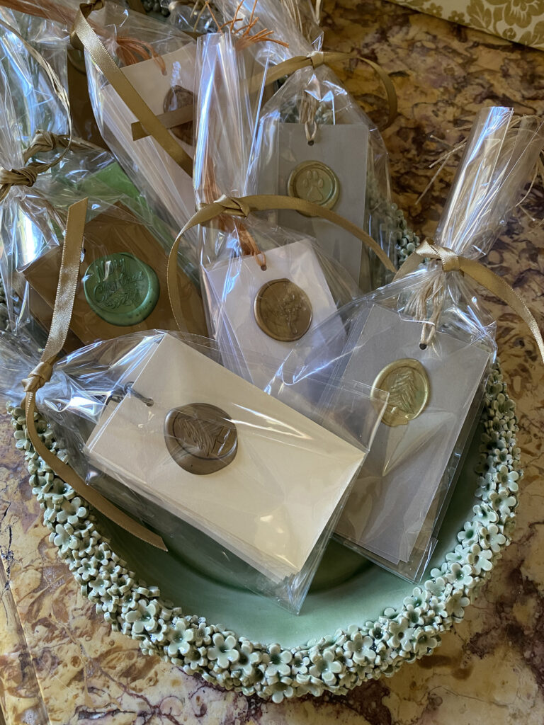 Holiday party favors gift tags and wax seals. 