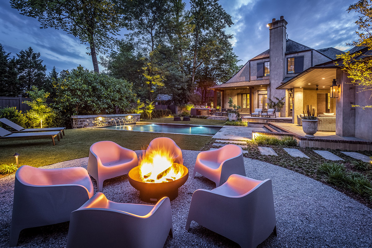 Firepit and pool in backyard for entertaining guests