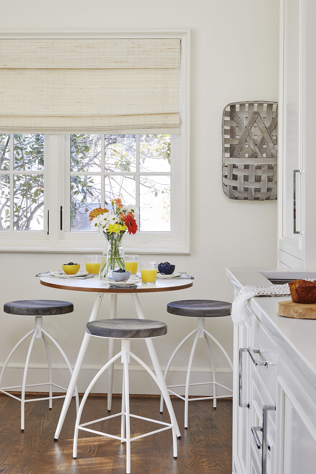 A casual dining table with barstools in the backyard guest house.