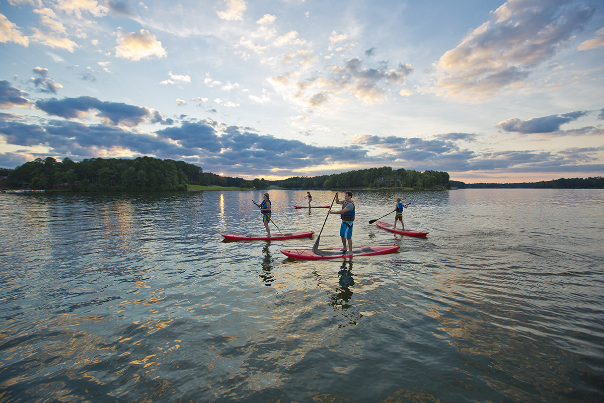 A family paddleboarding on Lake Oconee